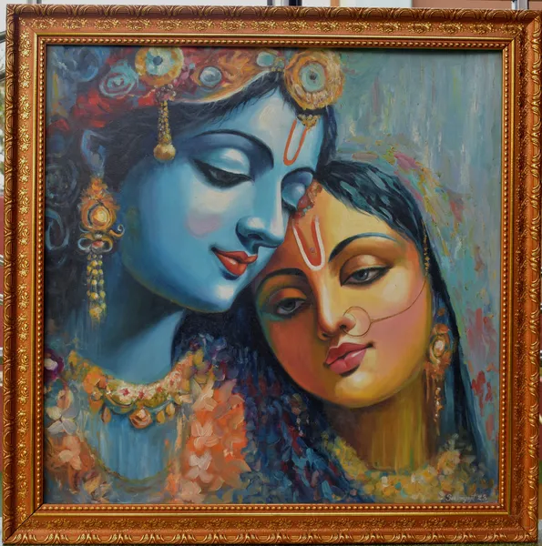 Divine Devotion: Krishna and Radha in Celestial Embrace